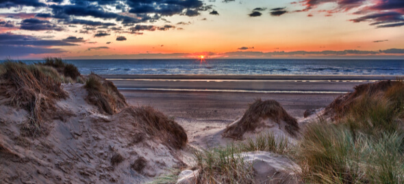 Sunset over Formby Beach through dunes